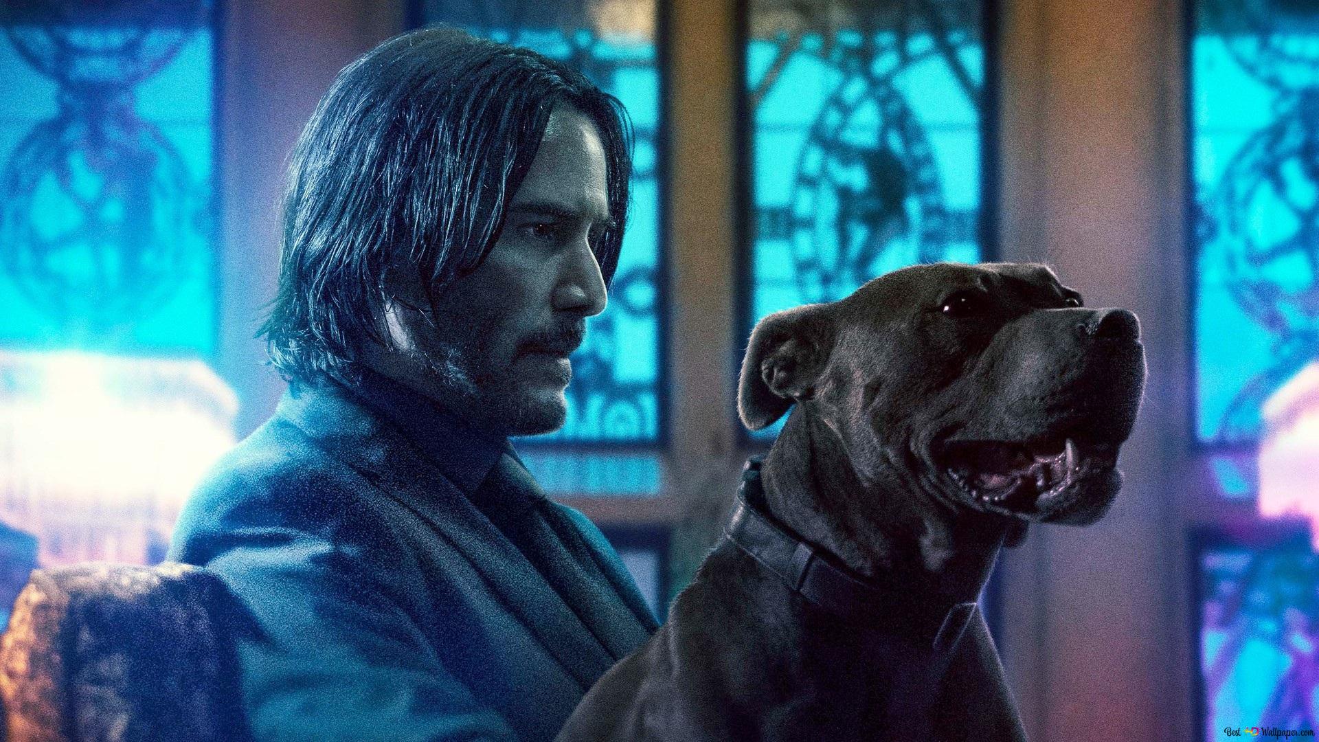 Imagen promocional de Keanu Reeves como John Wick con su perro